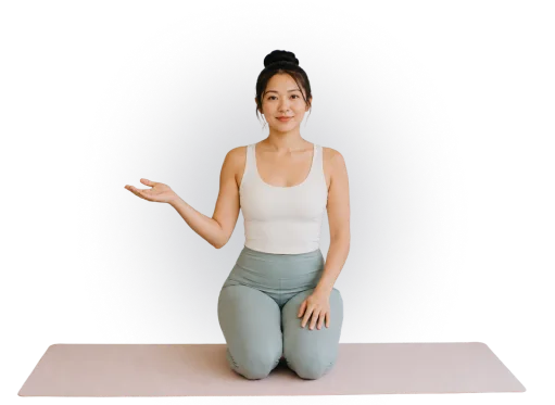 Yoga instructor kneeling on a mat